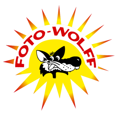 Foto-Wolff-Logo als Sonne mit lächelndem Wolf